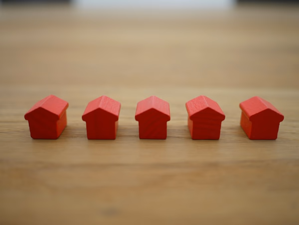 Professional mortgage broker meeting with clients discussing home financing options